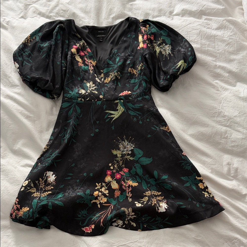 Mini black dress with bubble sleeves and flare skirt